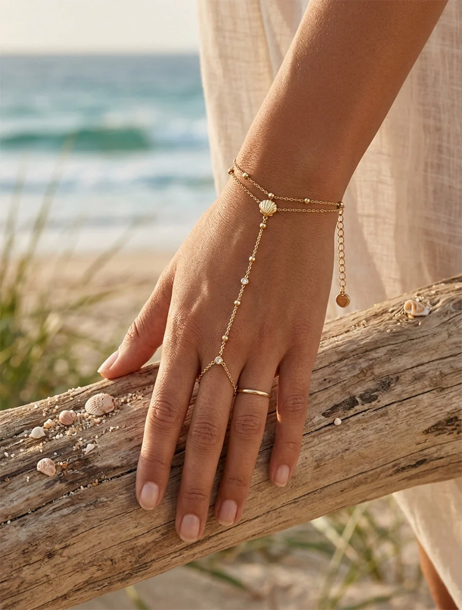 Schelp en witte zirkonia handketting - Goud